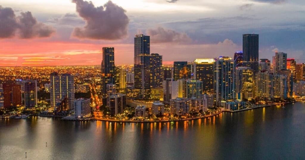 The Brickell and downtown Miami skyline at dusk. Home of Giraldo Associates.